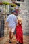 Walk in European city, old and beautiful buildings around. Rear view of lovely couple on date at summertime. Date, honeymoon, love