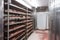 walk-in freezer with shelves full of various meat products, ready to be sold