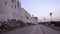 A walk on the medieval walls of the white village of Ostuni at sunset in summer