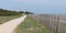 Walk path alley view of Baleines lighthouse in Ile de Re France in web banner template