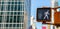 Walk traffic sign for pedestrians, blur office buildings background