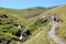 Walker on stony footpath by Scales Beck Blencathra