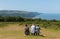 Walkers enjoying a rest in beautiful hot summer weather having climbed Selworthy Beacon, Somerset