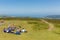 Walkers enjoying a rest in the beautiful summer weather having climbed to the top of Dunkery Beacon Somerset