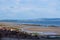 Walkers on Nairn beach at low tide North Scotland UK