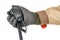 Walkie talkie handheld microphone with spiral connection cord in male hand in black protective glove and brown uniform isolated on