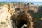 Walking along the sandy beaches and cliffs in Praia Do Alemao, Portimao in Algarve, southern Portugal