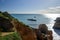 Walking along the sandy beaches and cliffs in Praia Do Alemao, Portimao in Algarve, southern Portugal