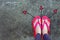 Walking Arrows Directions Drawn. Woman Wear Flip Flop Red and Yellow Standing on Cement Background