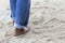 Walking bare feet on the beach