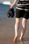 Walking barefoot through the surf