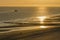 Walking on the beach at sunset