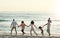 Walking, big family and holding hands at beach at sunset, having fun and bonding on vacation outdoors. Care, mockup and