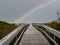 Walking Bridge to Ocean with a Beautiful Rainbow in the Sky