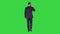 Walking business man with talking on mobile phone on a green screen, chroma key.