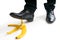 Walking businessman is going to slip on banana peel