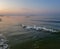 Walking catamaran against the backdrop of sunrise on the sea.