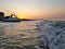 Walking catamaran against the backdrop of sunrise on the sea.