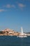 Walking catamaran and fortified city on rocky coast. Ibiza, Spain