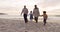 Walking, children and grandparents holding hands at beach for fun vacation, holiday or adventure at sunset. Senior man