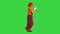 Walking clown playing the trumpet on a Green Screen, Chroma Key.