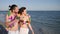 Walking couple in love, guy holding girl by hand, an exotic vacation, on background beach panorama, summer, slow motion,