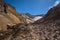 Walking into the crater of Mutnovsky Volcano on ash covered eternal snow