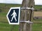 Walking direction sign indicating a path or public footpath