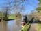 Walking down the canal footpath by the narrowboats