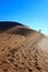 Walking in dune in Sossusvlei national park, Namibia