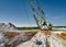 Walking excavator takes chalk with bucket in open quarry