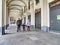 Walking family wearing protective masks in deserted city for nationwide lockdown caused by Coronavirus epidemic emergency