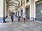 Walking family wearing protective masks in deserted city for nationwide lockdown caused by Coronavirus epidemic emergency