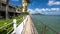 Walking famous Waikiki beach. Warm waves of the Pacific Ocean wash over a tropical Waikiki beach. Turquoise water