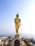 Walking golden buddha statue viewpoint in Nan