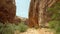 Walking between Huge mountain cliffs at Capitol Reef NP