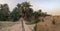 Walking through the Igrane garden near Merzouga, a typical agricultural oasis with small canals