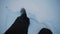 Walking man through the snow in the middle of tundra in Siberia , closeup capturing.