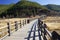 Walking Marriage Bridge wood ancient bridge,across Lugu lake in blue sky