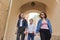 Walking mother and two daughters holding hands