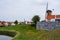 Walking in old Dutch town Zierikzee with old windmill, small houses and streets