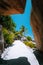 Walking path through giant bizarre granite rock boulders at the famous Anse Source d`Argent beach on island La Digue in