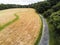 Walking path in a park by empty field, Selective focus. Aerial view