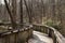 Walking path on wood boardwalk thru woods