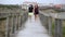 Walking on a pier over the dunes