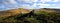 Walking poles and rucksack by the summit cairn