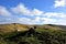 Walking poles and rucksack by the summit cairn