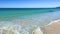 Walking POV of wave breaking gently on Bunker bay beach, near Dunsborough.