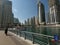 Walking Promenade at Dubai Marina with view of buildings and Yacht in Marina