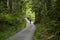 Walking the road following the Nakasendo trail between Nagiso and Tsumago in Kiso Valley, Japan.